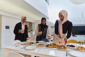 Group of young Arab women come together to lovingly prepare an iftar table during the sacred Muslim month of Ramadan, embodying the essence of communal unity, cultural tradition, and joyous photo