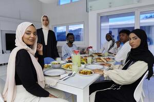 In the sacred month of Ramadan, a Muslim family joyously comes together around a table, eagerly awaiting the communal iftar, engaging in the preparation of a shared meal, and uniting in anticipation photo