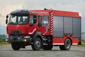 In this captivating scene, a state-of-the-art firetruck, equipped with advanced rescue technology, stands ready with its skilled firefighting team, prepared to intervene and respond rapidly to photo