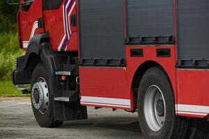 In this captivating scene, a state-of-the-art firetruck, equipped with advanced rescue technology, stands ready with its skilled firefighting team, prepared to intervene and respond rapidly to photo