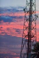 a tower with a cell phone on top of it photo