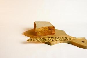 photography of bread with wheat on a white background photo