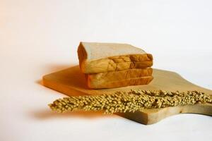 photography of bread with wheat on a white background photo