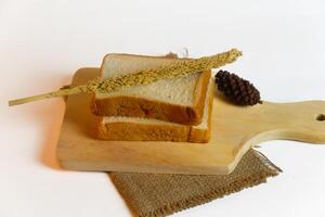 photography of bread with wheat on a white background photo