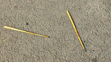 two sticks laying on the ground photo