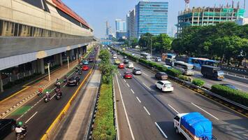 a busy highway with many cars and buses photo
