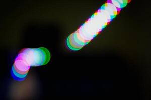 Defocused abstract background of red, blue, and green light in the night photo