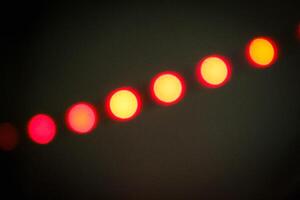 Defocused abstract background of red light in the night photo