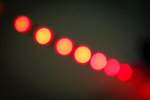 Defocused abstract background of red light in the night photo