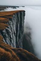 a view of the mountains and fog from a cliff photo