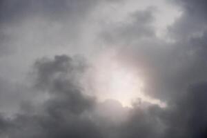 Abstact of nature background of dark sky before rainy time. With light of sun survive. photo