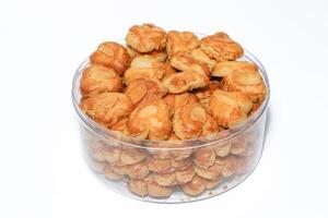 peanut almond cookies topped with sliced peanuts. photo