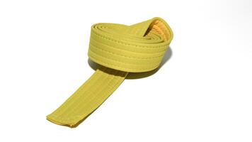 A picture of taekwondo belt on white background with selective focus photo