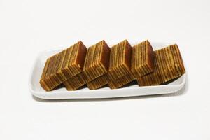 Lapis legit or traditional Indonesian sweet lapis cake on a white background photo