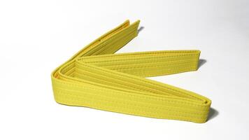 A picture of taekwondo belt on white background with selective focus photo