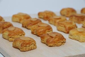 peanut almond cookies topped with sliced peanuts. photo