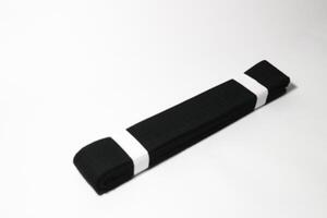 A picture of taekwondo belt on white background with selective focus photo