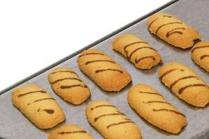 Kue lidah kucing or cat's tongue cookies. traditional cookies for eid holiday in indonesia. kue lebaran. photo