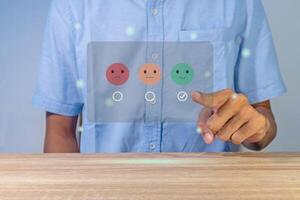 Man gives rating to service experience on virtual screen. Customer review satisfaction feedback concept. photo