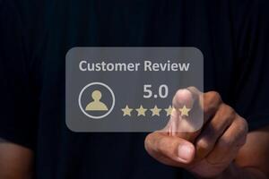 A man gives rating to service experience on online application. Customer review satisfaction feedback concept. photo
