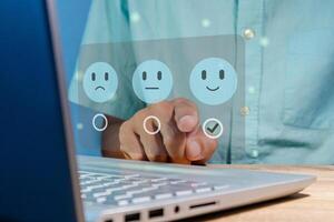 Man gives rating to service experience on virtual screen. Customer review satisfaction feedback concept. photo