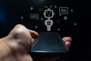 Hand holding a smart phone with virtual screen of artificial intelligence robot or chatbot technology concept. photo