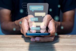 A man types a message on a smart phone. Chatting, communication, dialog, conversation, and virtual relationship concept. photo