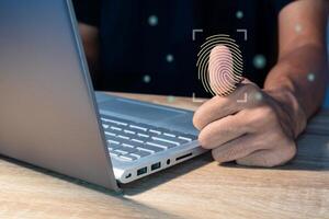A man login with fingerprint scanning technology. Biometric authentication, cybersecurity and fingerprint password concept. photo
