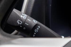 Close up view of car windshield wiper switch control photo