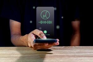 Man using virtual voice assistant on a smartphone photo