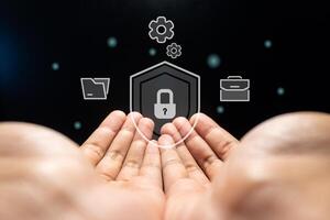 Hands with virtual screen of cyber security technology for protecting personal data and secure internet access concept. photo