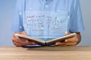 Man holding a notebook for studying mathematics photo
