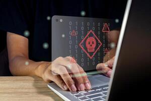 Hacker or Cyber criminal with laptop stealing user personal data. Internet phishing concept. photo