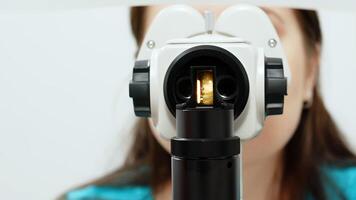 Close-up Ophthalmic laser system. Laser treatmnet for myopia. The concept of ophthalmology and medicine. Medical attendance at the optometrist in a bright modern clinic photo