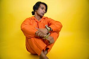 Man Looking down with handcuffs on wrists photo