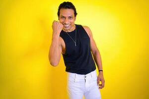 Smiling man posing with a fist photo