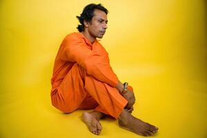 Depressive prisoner on floor photo