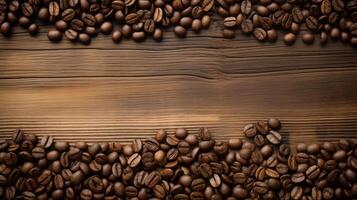 Coffee bean border with text space on wooden background, photo shot