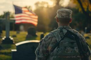 Military man in uniform stands alone at cemetery photo
