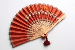 red hand fan isolated on white background. photo