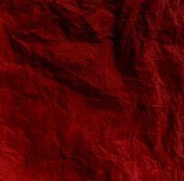 Abstract wrinkled or Free photo crumpled red paperboard or empty canvas or paper surface or fabric stain background.