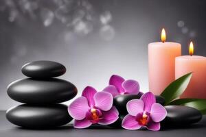 Spa gray background with massage stones, exotic flowers and copy space. photo