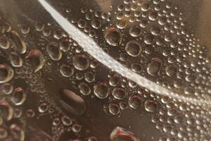 Water droplets on reflective surface photo