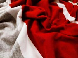 The texture and background of the fabric is white, gray and red photo