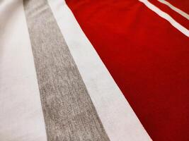 The texture and background of the fabric is white, gray and red photo