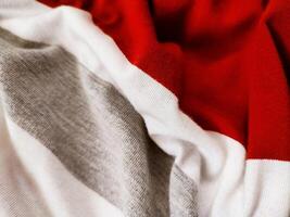 The texture and background of the fabric is white, gray and red photo