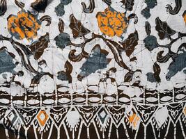 The fabric is patterned with a dense arrangement of blooming floral motifs in medium tones photo