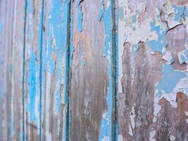background of old wooden blue planks whose paint is faded and peeling photo