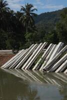 A group of concrete blocks are on the water photo