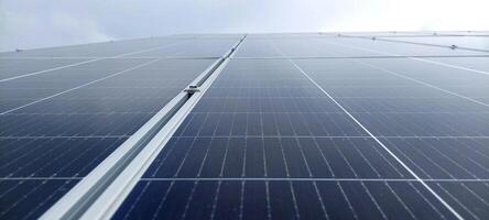 Solar cell panels with a sky background. Solar battery farm. An alternative source of electricity photo